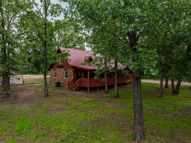1501 NE 775th Rd, Osceola, MO 64776 - back of house featuring a wooden deck, cooling unit, and metal roof