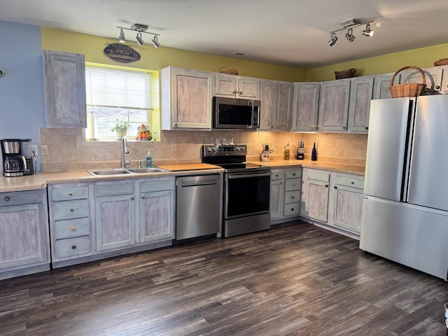 3600 Steven Dr, Cabool, MO 65689 - kitchen featuring stainless steel appliances, a sink, light countertops, backsplash, and track lighting