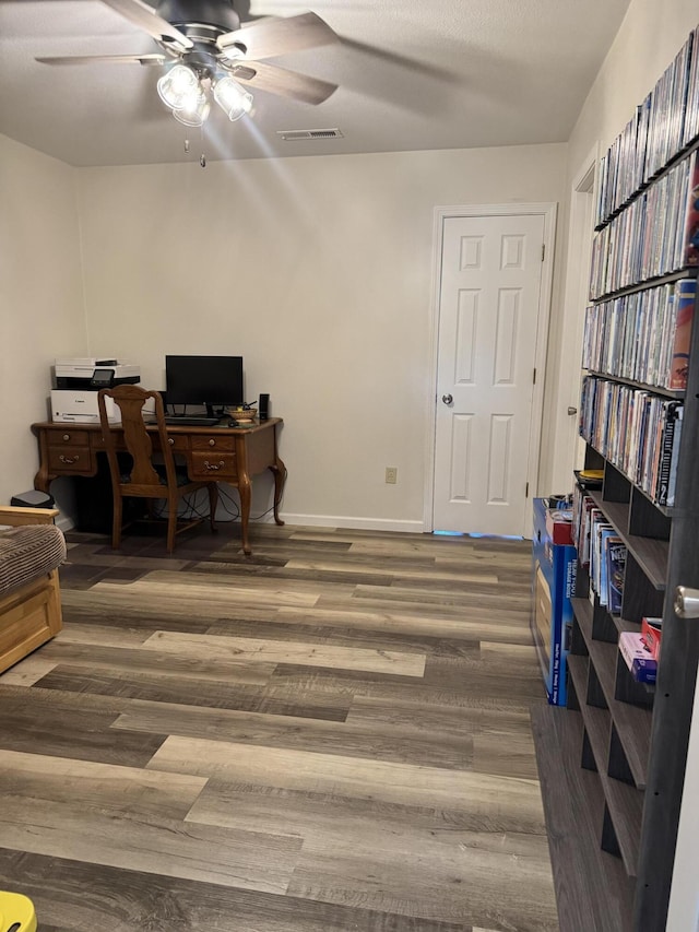 3600 Steven Dr, Cabool, MO 65689 - home office with a ceiling fan, wood finished floors, and baseboards