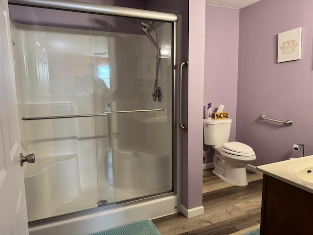 3600 Steven Dr, Cabool, MO 65689 - bathroom featuring vanity, wood finished floors, a shower stall, and baseboards