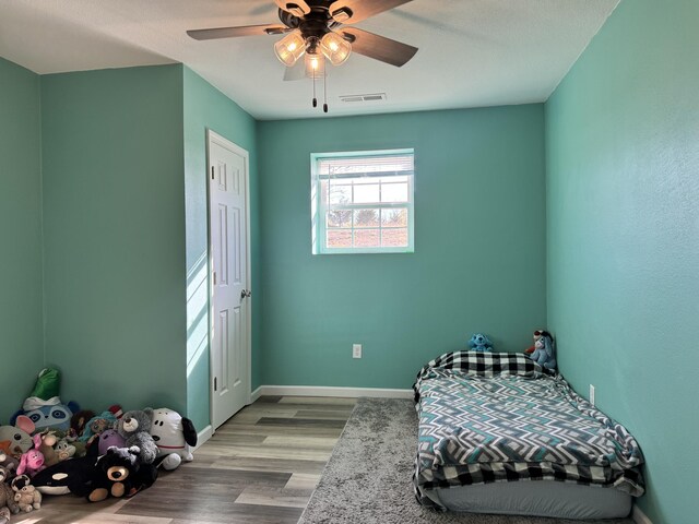 3600 Steven Dr, Cabool, MO 65689 - bedroom with wood finished floors, baseboards, and ceiling fan