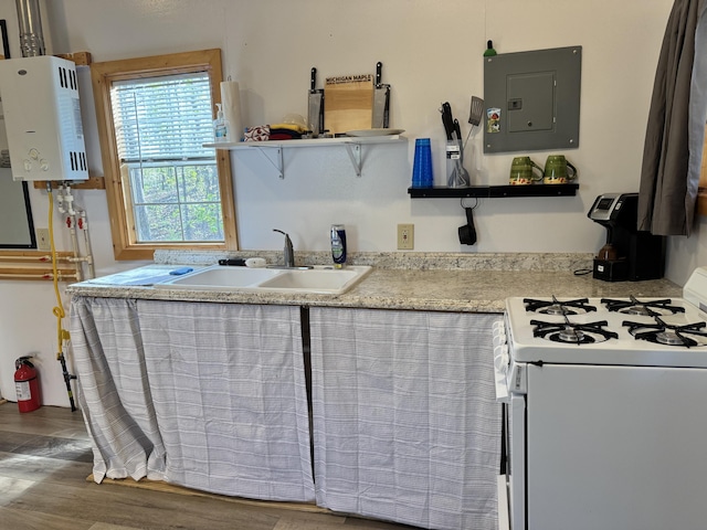 000 Steven Dr, Cabool, MO 65689 - kitchen featuring white range with gas stovetop, electric panel, open shelves, water heater, and a sink