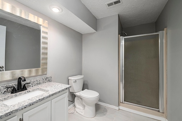 617 E SE Hills Ct, Nixa, MO 65714 - bathroom featuring vanity, a stall shower, toilet, baseboards, and a textured ceiling