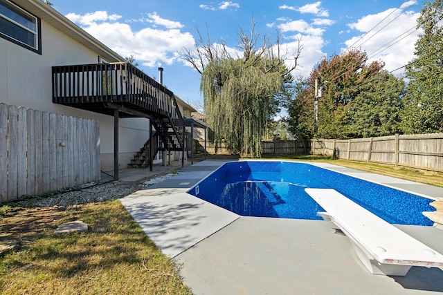 617 E SE Hills Ct, Nixa, MO 65714 - view of pool with a fenced backyard, stairway, a diving board, a wooden deck, and a patio
