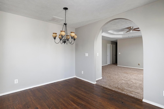 617 E SE Hills Ct, Nixa, MO 65714 - unfurnished room featuring baseboards, arched walkways, a ceiling fan, a chandelier, and dark wood-style floors