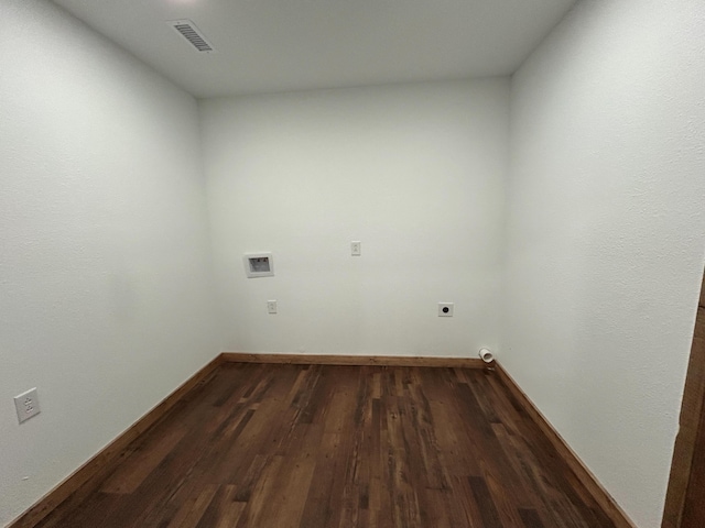 19040 Norway Rd, Neosho, MO 64850 - washroom featuring hookup for an electric dryer, washer hookup, dark wood-type flooring, and baseboards