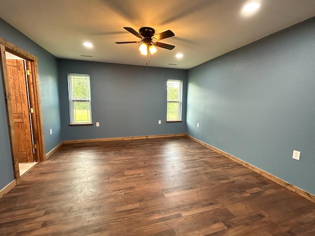 19040 Norway Rd, Neosho, MO 64850 - empty room featuring a ceiling fan, healthy amount of natural light, dark wood-style flooring, baseboards, and recessed lighting