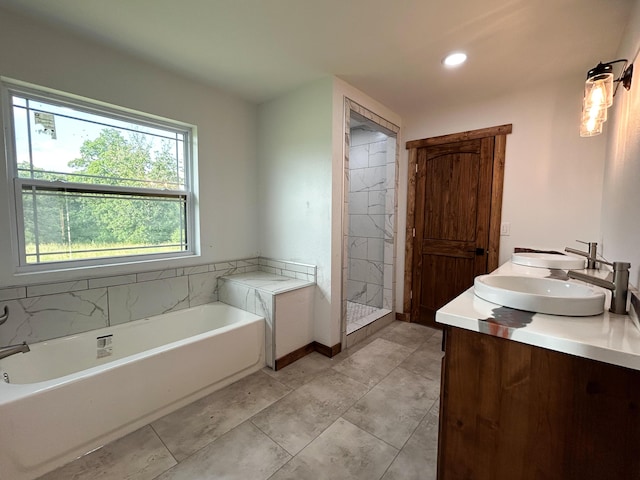 19040 Norway Rd, Neosho, MO 64850 - bathroom with a garden tub, double vanity, and recessed lighting