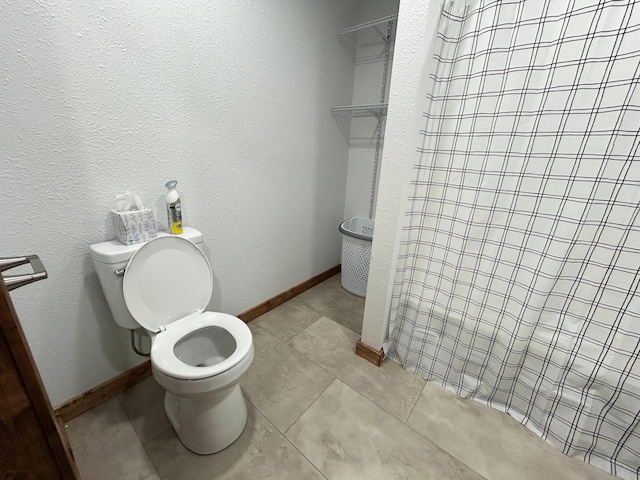 19040 Norway Rd, Neosho, MO 64850 - full bath with toilet, a shower, and tile patterned floors