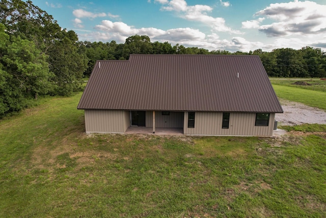 19040 Norway Rd, Neosho, MO 64850 - rear view of property featuring a lawn, metal roof, and a patio