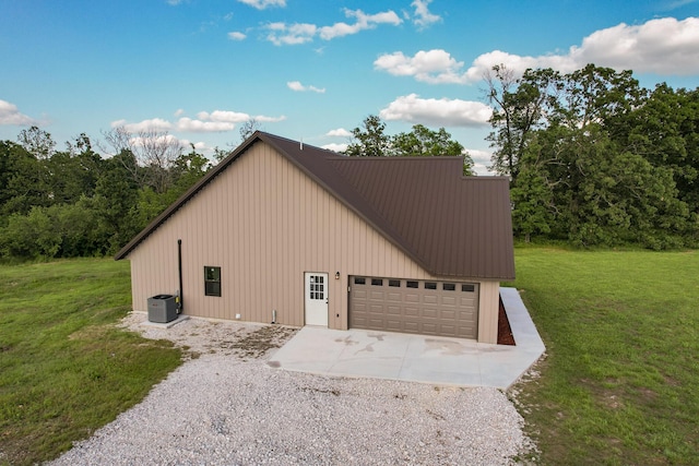 19040 Norway Rd, Neosho, MO 64850 - view of home's exterior featuring concrete driveway, a yard, metal roof, and board and batten siding