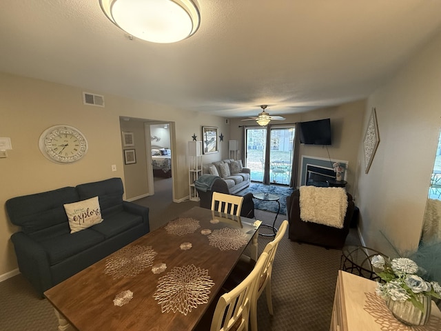 132 Highland Dr Unit 2, Branson, MO 65616 - living room featuring carpet floors, a ceiling fan, and baseboards