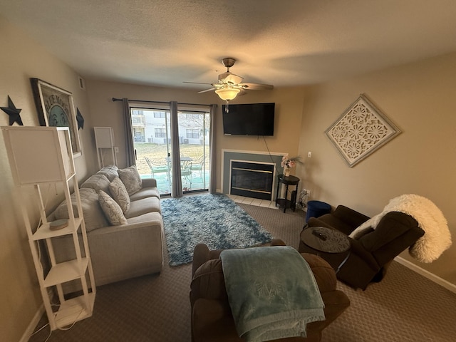 132 Highland Dr Unit 2, Branson, MO 65616 - living room with carpet flooring, ceiling fan, baseboards, and a fireplace with flush hearth