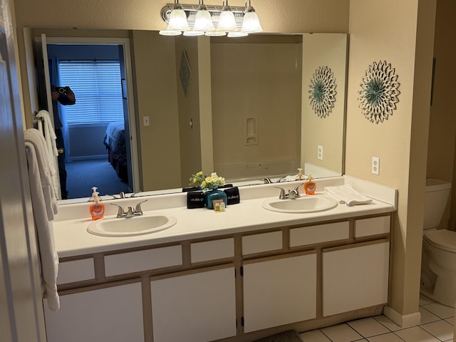 132 Highland Dr Unit 2, Branson, MO 65616 - full bathroom with toilet, double vanity, tile patterned flooring, and ensuite bathroom