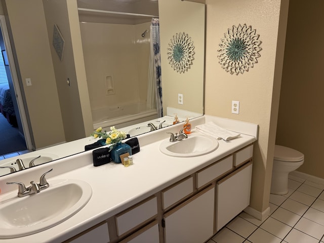 132 Highland Dr Unit 2, Branson, MO 65616 - bathroom featuring toilet, tile patterned flooring, double vanity, baseboards, and shower / tub combo