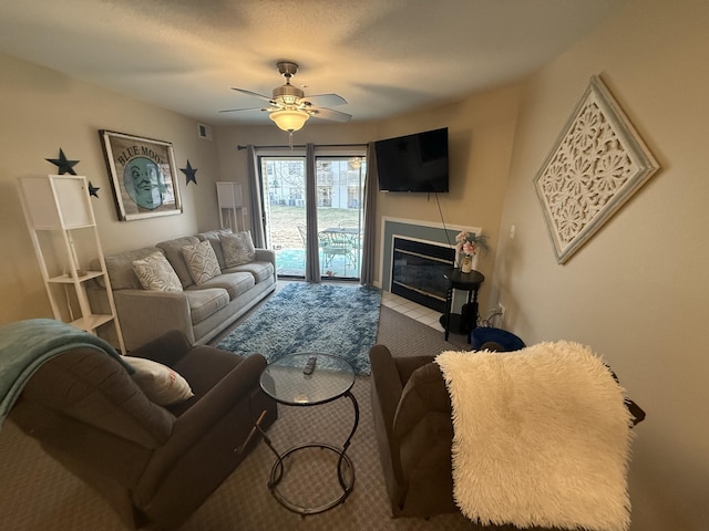 132 Highland Dr Unit 2, Branson, MO 65616 - carpeted living room with a ceiling fan and a fireplace with flush hearth