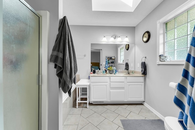 1108 E Robin St, Ozark, MO 65721 - bathroom featuring a skylight, a shower stall, tile patterned floors, double vanity, and toilet