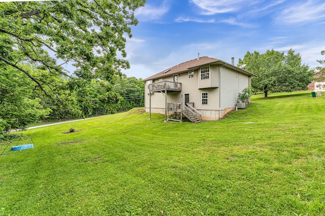 1108 E Robin St, Ozark, MO 65721 - view of green lawn featuring stairs, central AC unit, and a deck