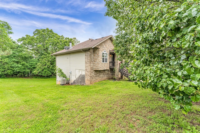 1108 E Robin St, Ozark, MO 65721 - view of property exterior with stone siding and a lawn
