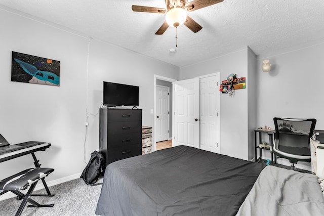 1108 E Robin St, Ozark, MO 65721 - bedroom with a textured ceiling, baseboards, ceiling fan, and light colored carpet