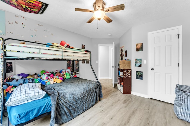 1108 E Robin St, Ozark, MO 65721 - bedroom with wood finished floors, baseboards, and a ceiling fan