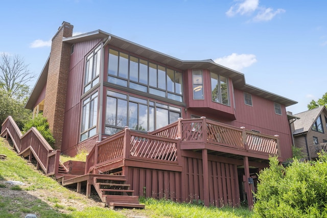 6 Cedar Ln, Kimberling City, MO 65686 - back of property featuring a chimney, a deck, and stairs