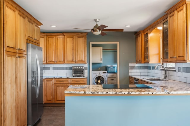 6 Cedar Ln, Kimberling City, MO 65686 - kitchen featuring stainless steel fridge, washer / dryer, a sink, a ceiling fan, and a peninsula