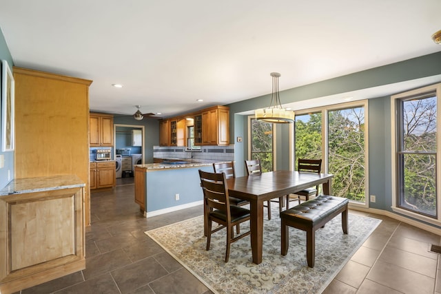 6 Cedar Ln, Kimberling City, MO 65686 - dining room featuring recessed lighting, independent washer and dryer, a chandelier, dark tile patterned floors, and baseboards