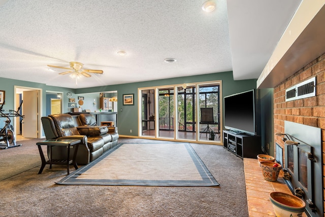 6 Cedar Ln, Kimberling City, MO 65686 - carpeted living area featuring a fireplace, a textured ceiling, and a ceiling fan