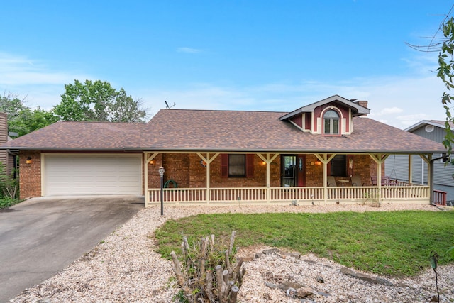 6 Cedar Ln, Kimberling City, MO 65686 - view of front of house with a chimney, asphalt driveway, a porch, a garage, and a front lawn