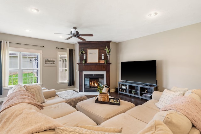 403 S 3rd St, Ozark, MO 65721 - living area featuring baseboards, a ceiling fan, a fireplace, dark wood-style flooring, and recessed lighting