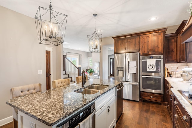 403 S 3rd St, Ozark, MO 65721 - kitchen featuring stainless steel appliances, a sink, a chandelier, dark wood-style floors, and recessed lighting