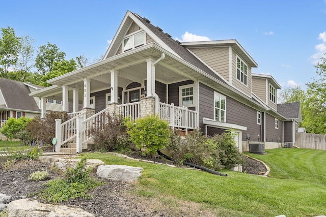 403 S 3rd St, Ozark, MO 65721 - view of front of home featuring central AC unit, a front yard, a porch, and a shingled roof