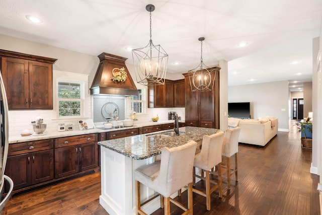 403 S 3rd St, Ozark, MO 65721 - kitchen featuring custom range hood, a sink, stone countertops, decorative backsplash, and dark wood finished floors