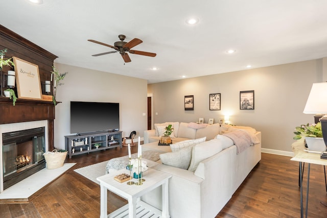 403 S 3rd St, Ozark, MO 65721 - living room with ceiling fan, dark wood finished floors, baseboards, a fireplace with flush hearth, and recessed lighting