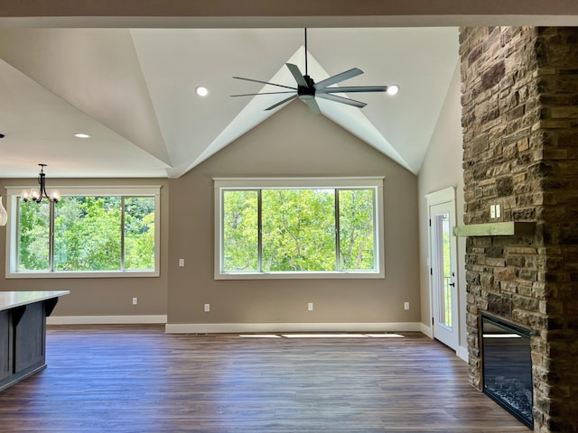 409 Silverwood Cir, Branson West, MO 65737 - unfurnished living room featuring plenty of natural light, a ceiling fan, baseboards, and vaulted ceiling