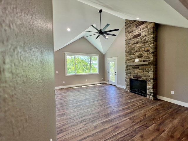 409 Silverwood Cir, Branson West, MO 65737 - unfurnished living room featuring ceiling fan, wood finished floors, a fireplace, beamed ceiling, and baseboards