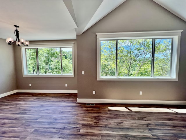 409 Silverwood Cir, Branson West, MO 65737 - empty room featuring a chandelier, baseboards, wood finished floors, and vaulted ceiling