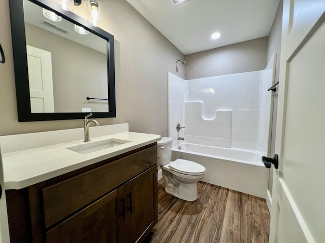 409 Silverwood Cir, Branson West, MO 65737 - bathroom featuring wood finished floors, toilet, vanity, and tub / shower combination