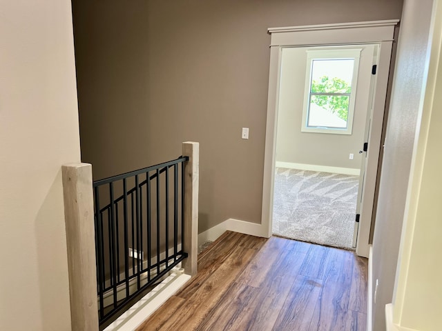 409 Silverwood Cir, Branson West, MO 65737 - hallway featuring an upstairs landing, baseboards, and wood finished floors