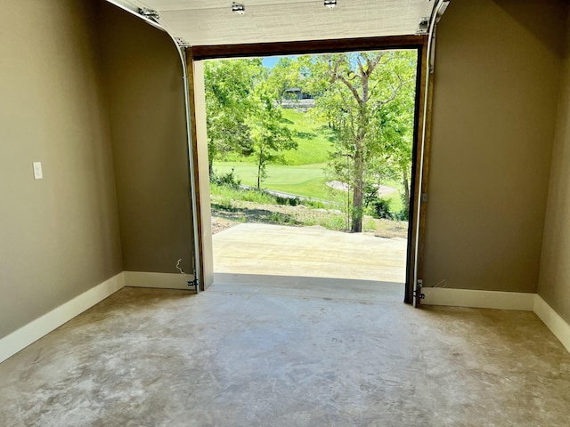 409 Silverwood Cir, Branson West, MO 65737 - garage with baseboards and golf course view