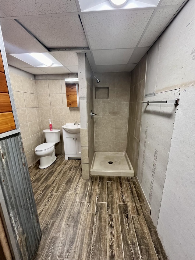 194 State Highway T, Oldfield, MO 65720 - full bath featuring wood finished floors, a stall shower, vanity, toilet, and a paneled ceiling