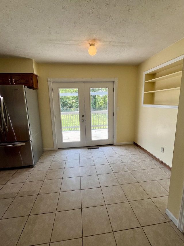 194 State Highway T, Oldfield, MO 65720 - entryway with french doors, baseboards, a textured ceiling, light tile patterned floors, and built in features