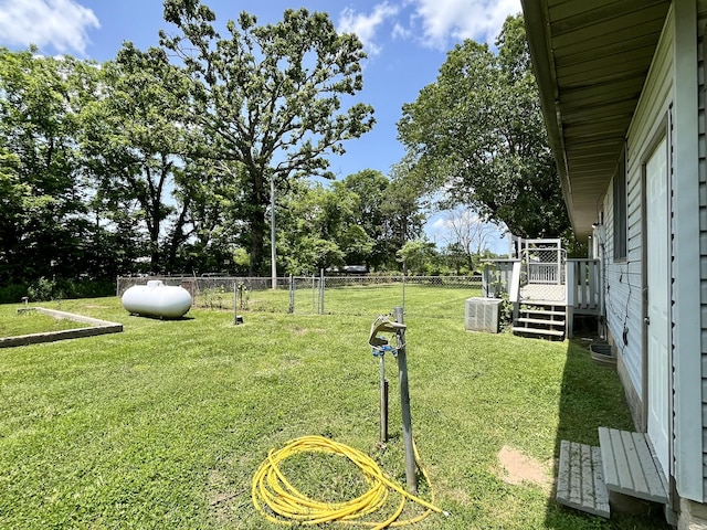 194 State Highway T, Oldfield, MO 65720 - view of yard featuring a deck, view of scattered trees, and central AC unit