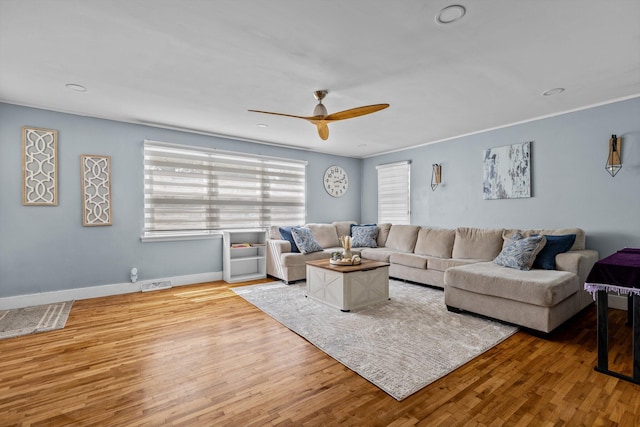 1103 4th St, Monett, MO 65708 - living area with wood finished floors, a ceiling fan, baseboards, and recessed lighting