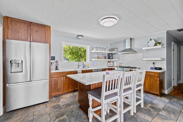 1103 4th St, Monett, MO 65708 - kitchen with appliances with stainless steel finishes, open shelves, wall chimney range hood, and brown cabinets