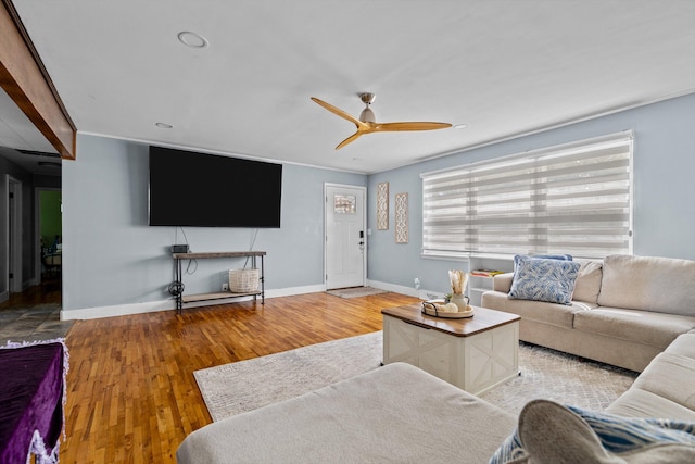 1103 4th St, Monett, MO 65708 - living room featuring wood finished floors, baseboards, and ceiling fan