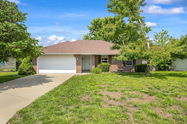 849 S Mahn Ave, Springfield, MO 65802 - ranch-style house featuring a garage, driveway, a front lawn, brick siding, and a shingled roof