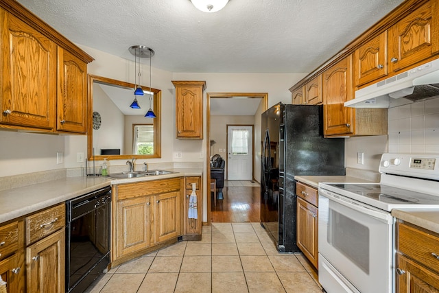 849 S Mahn Ave, Springfield, MO 65802 - kitchen featuring white electric stove, black dishwasher, a sink, under cabinet range hood, and brown cabinets