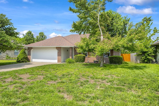 849 S Mahn Ave, Springfield, MO 65802 - view of front of property with brick siding, a garage, driveway, and roof with shingles